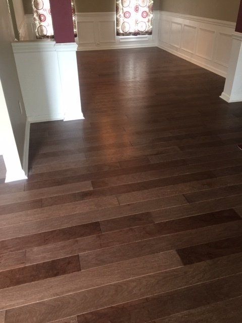 Worker installing hardwood flooring